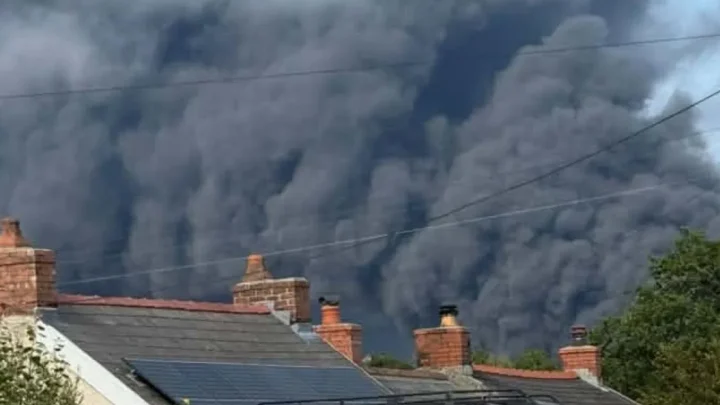 Huge inferno sweeps over oil refinery site as villagers urged to stay back